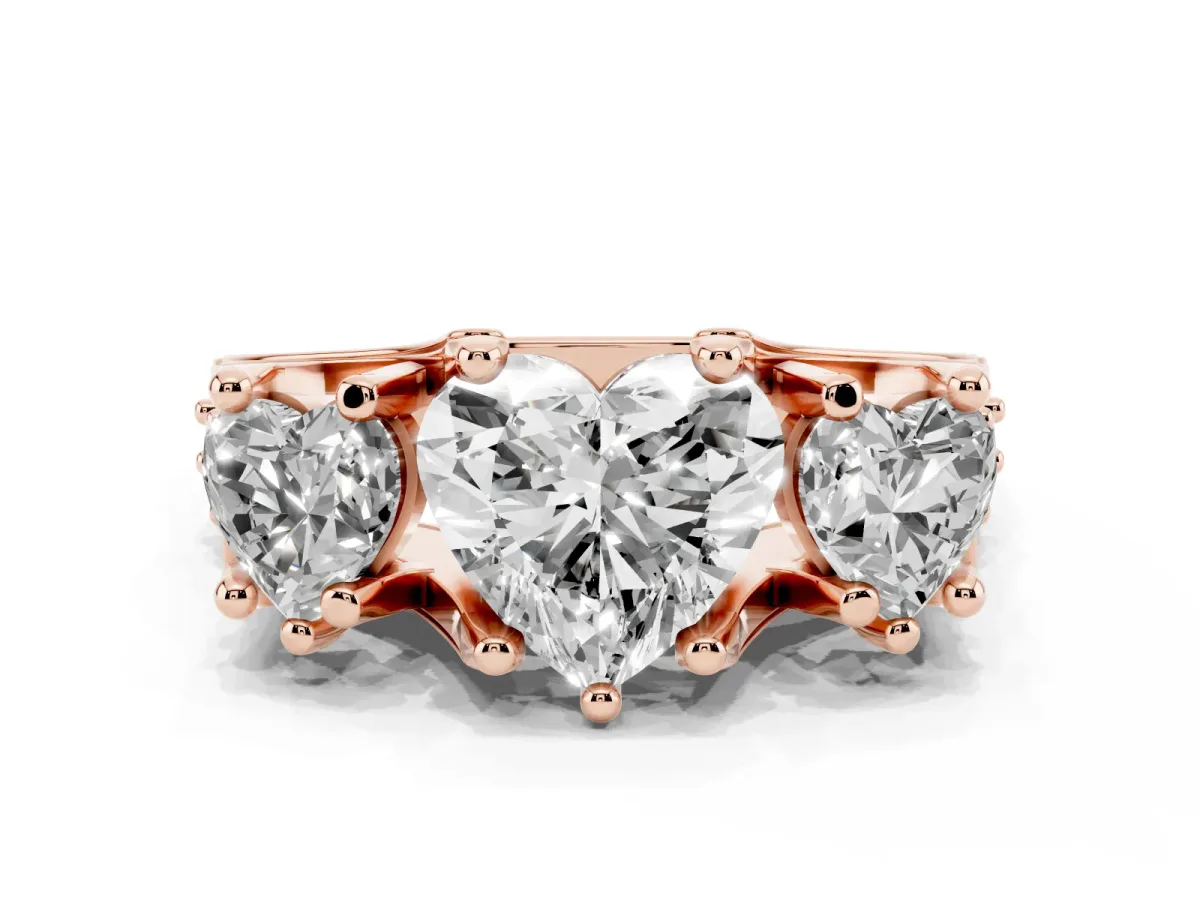 Heart Cut Diamond Three-Stone Ring with Channel Set Band and Four-Prong Setting Rose gold
