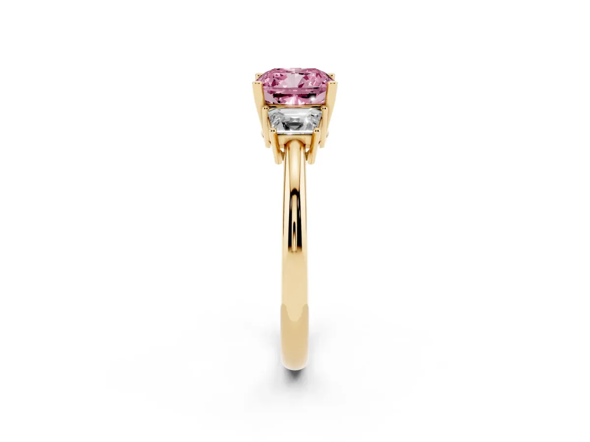 Fancy Pink Cushion Cut Diamond Three-Stone Ring with Trapezoid Side Stones and Prong Setting Yellow gold