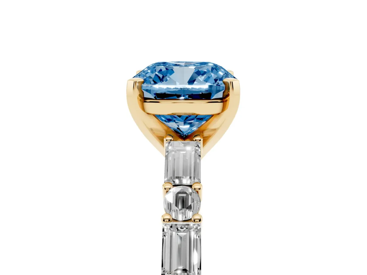 Fancy Blue Cushion Cut Diamond Solitaire with Side Baguettes and Channel Set Band Yellow gold