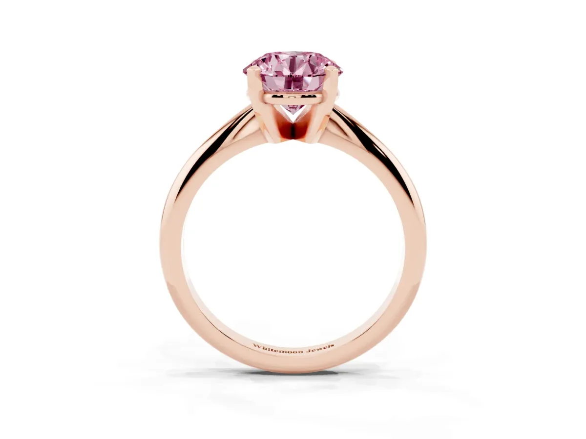 Fancy Pink Round Cut Cut Solitaire Ring with Four-Prong Setting on a Classic Band Rose gold