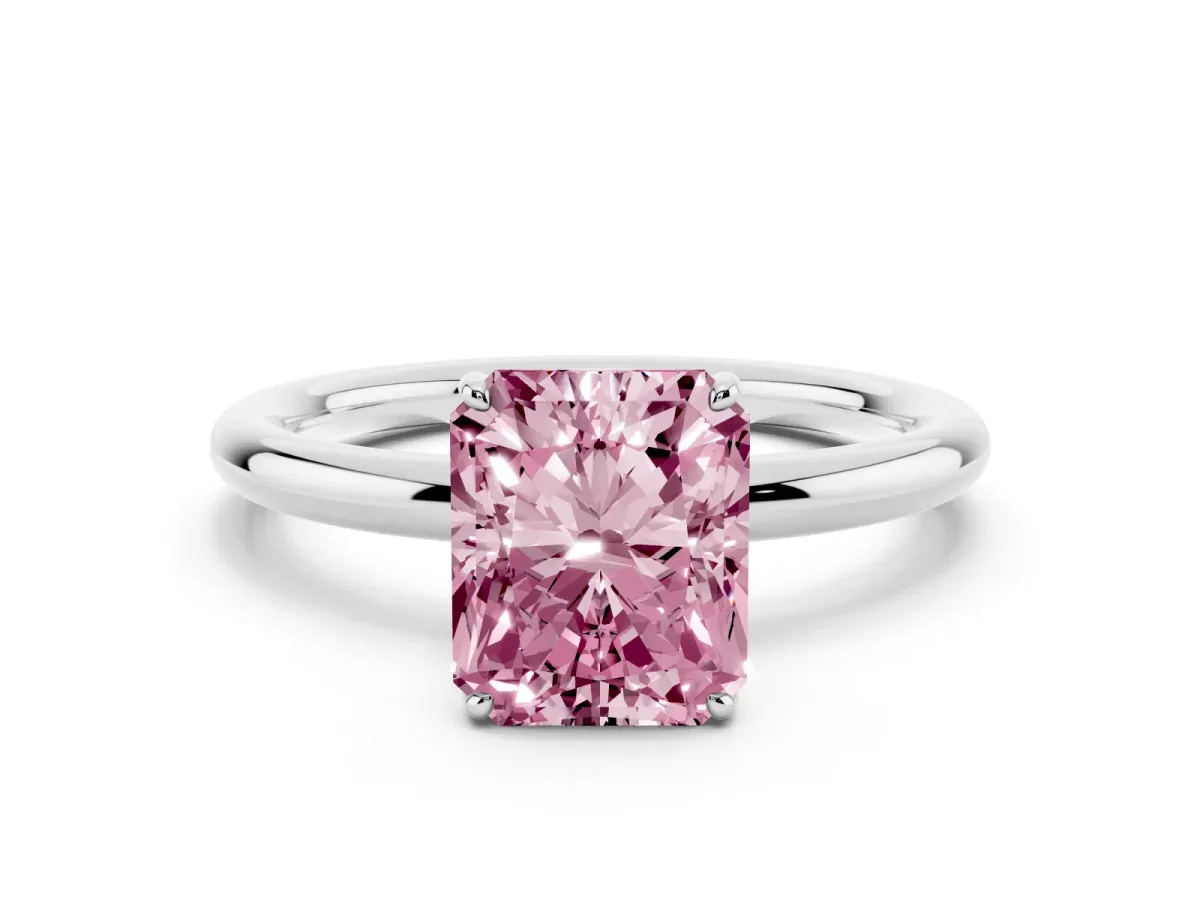 Fancy Pink Radiant Cut Solitaire Diamond Ring with Four-Prong Setting on a Plain Band Platinum