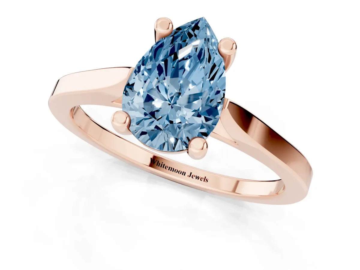 Fancy Blue Pear Cut Solitaire Diamond Ring with Four-Prong Setting and Tapered Band Rose gold