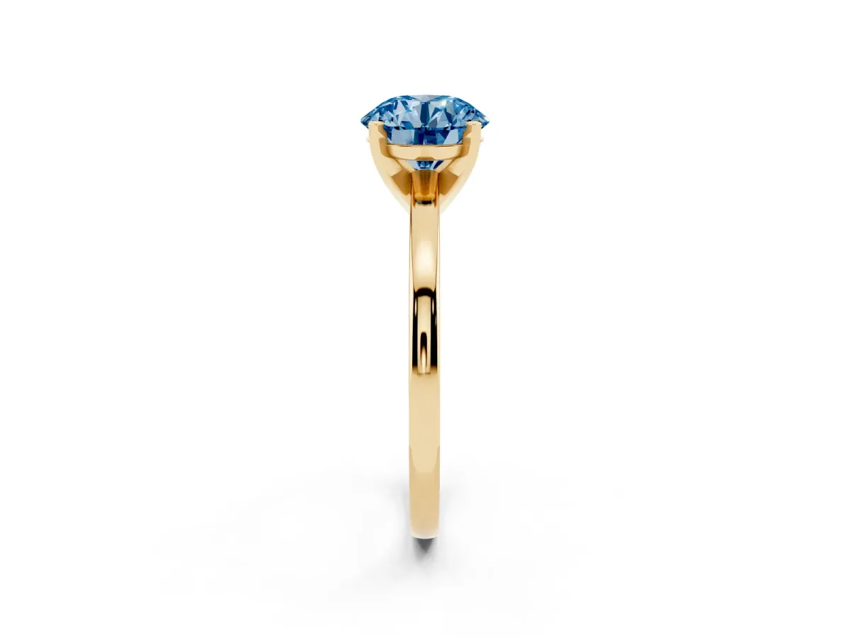 Fancy Blue Round Cut Solitaire Diamond Engagement Ring with Four-Prong Setting on a Classic Band Yellow gold