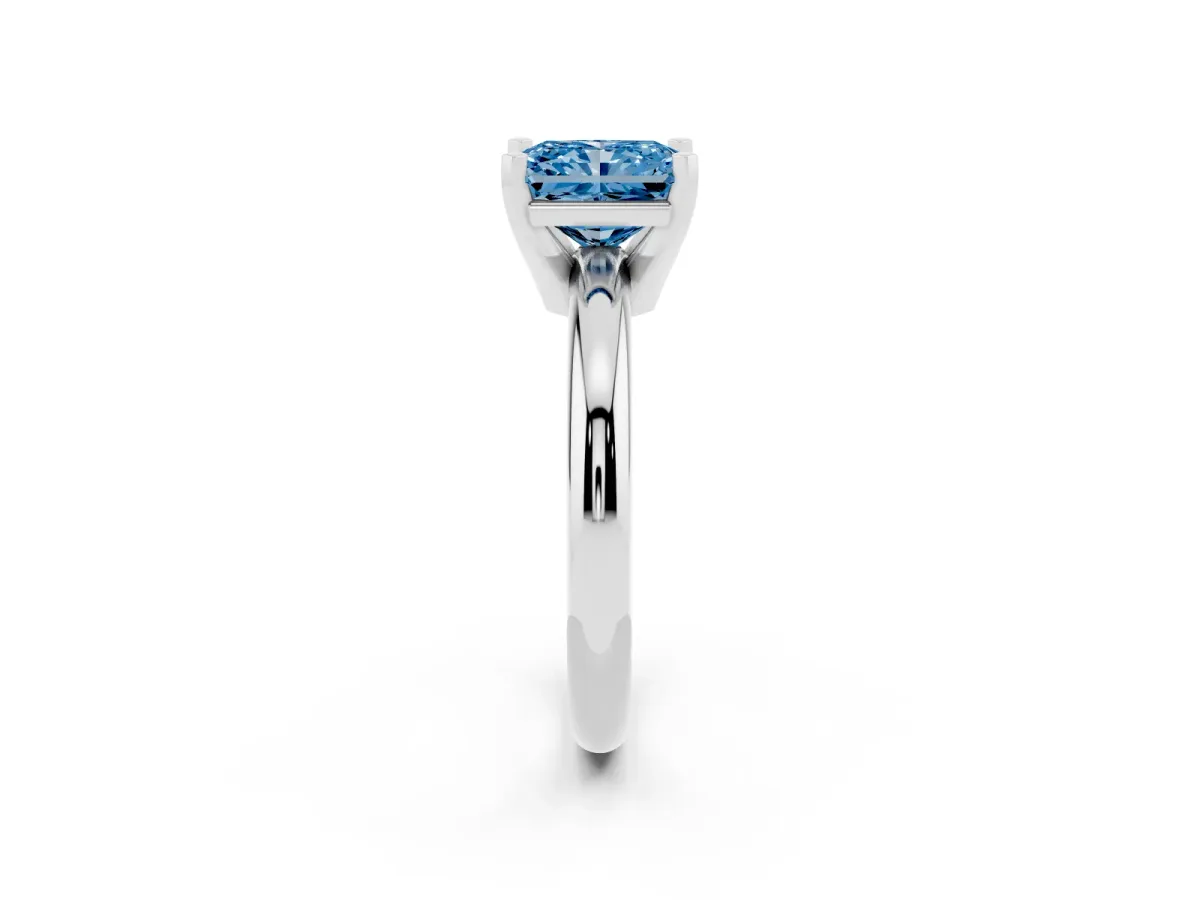 Fancy Blue Radiant Cut Diamond Solitaire Engagement Ring with Round Band and Four-Prong Setting Platinum