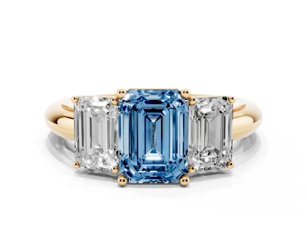 Fancy Blue Three-Stone Emerald Cut Cut Diamond Engagement Ring with Prong Setting on a White Gold Band Yellow gold