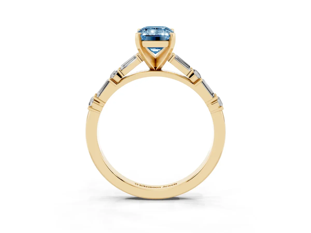 Fancy Blue Emerald Cut Diamond Solitaire with Side Baguettes and Channel Set Band Yellow gold