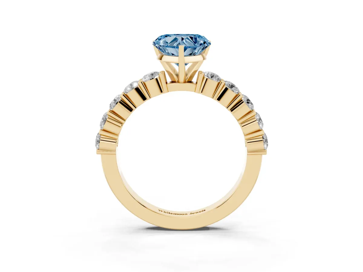 Fancy Blue Heart Cut Diamond Solitaire Ring with Shared Prong Round Side Stones Yellow gold