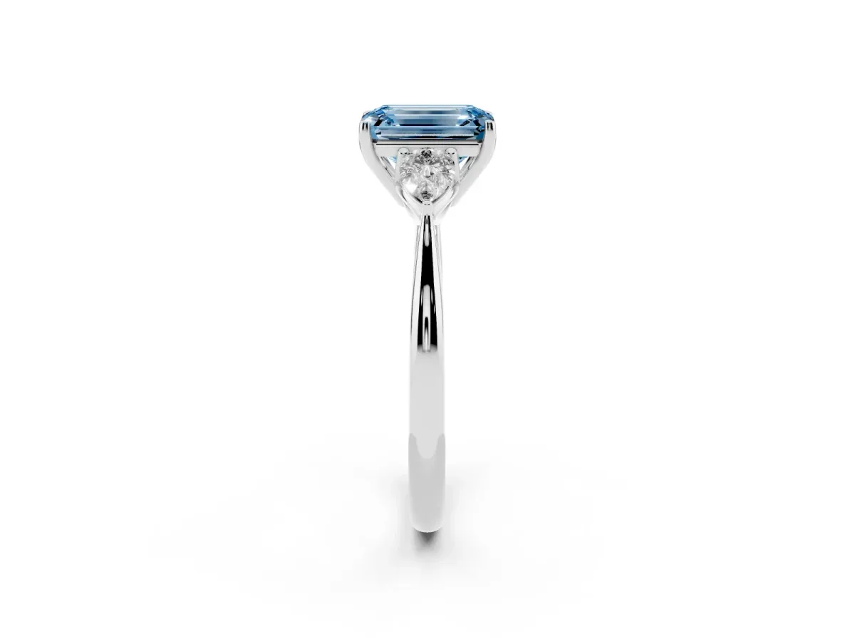 Fancy Blue Three-Stone Emerald Cut Diamond Ring with Pear Side Stones in Four-Prong Setting Silver