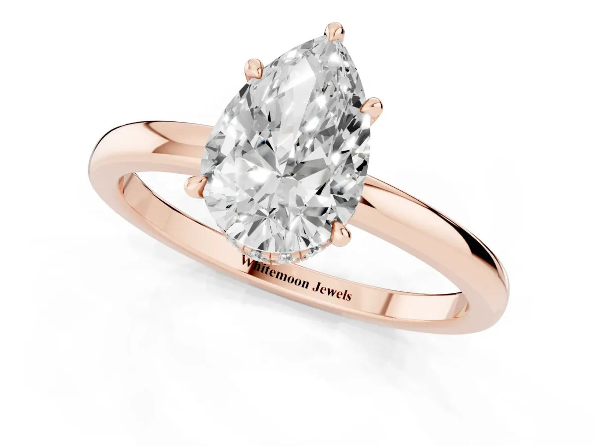 Pear Cut Solitaire Engagement Ring with Cathedral Band and Four-Prong Setting Rose gold