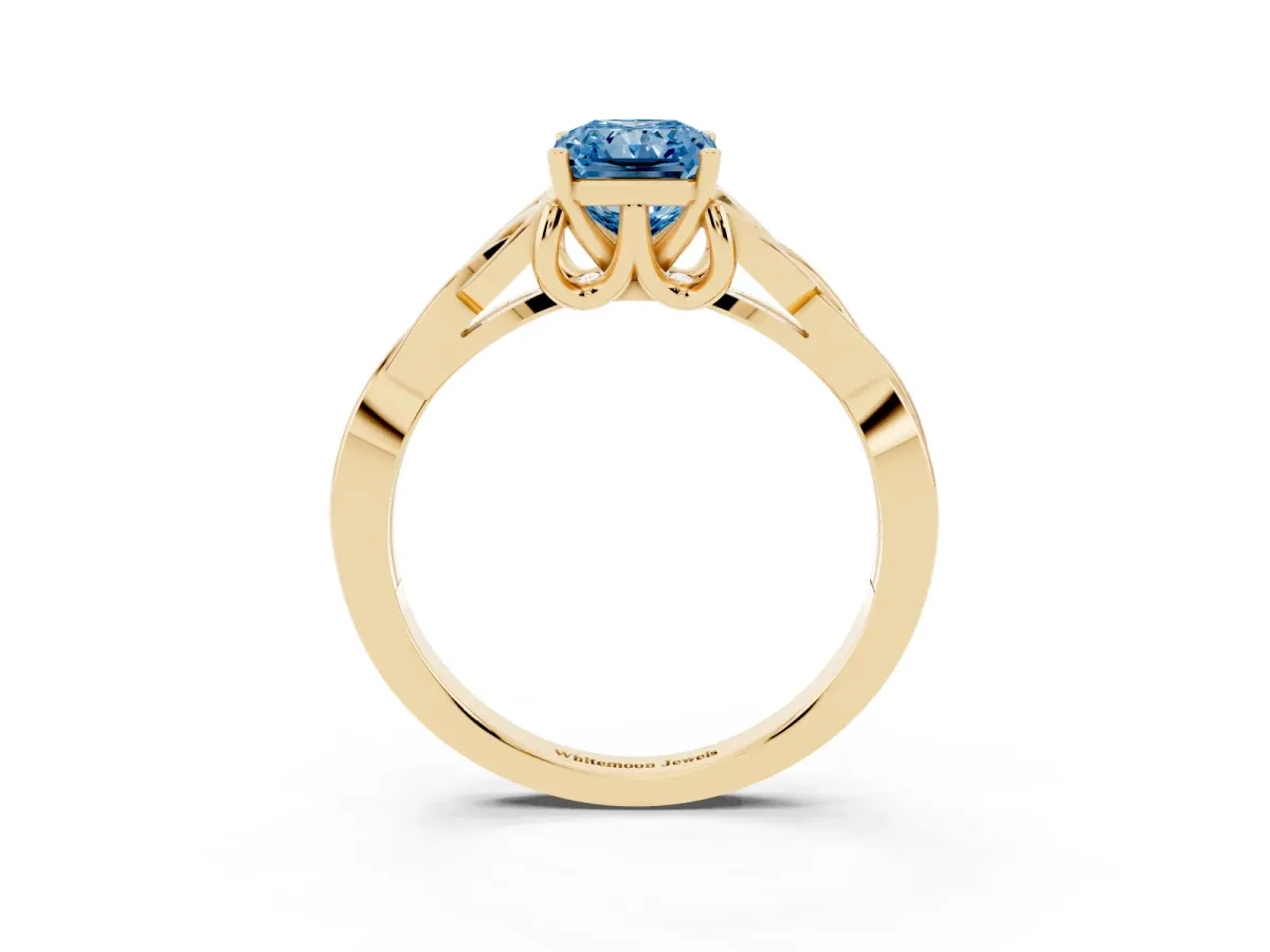 Fancy Blue Radiant Cut Diamond Solitaire Engagement Ring with Celtic Knot Band and Four-Prong Setting Yellow gold