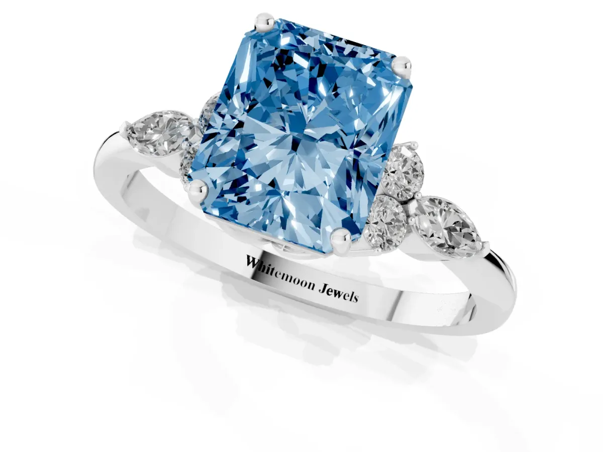 Fancy Blue Radiant Cut Brilliant Diamond Solitaire Ring with Pear Side Stones and Four-Prong Setting Silver