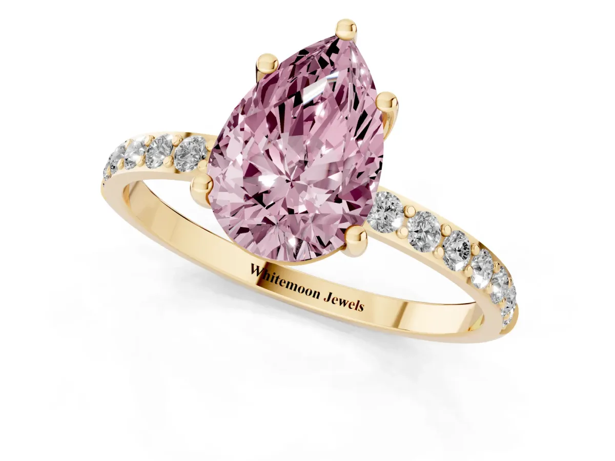 Fancy Pink Pear Cut Diamond Solitaire Ring with Round Pavé Shoulders and Prong Setting Yellow gold