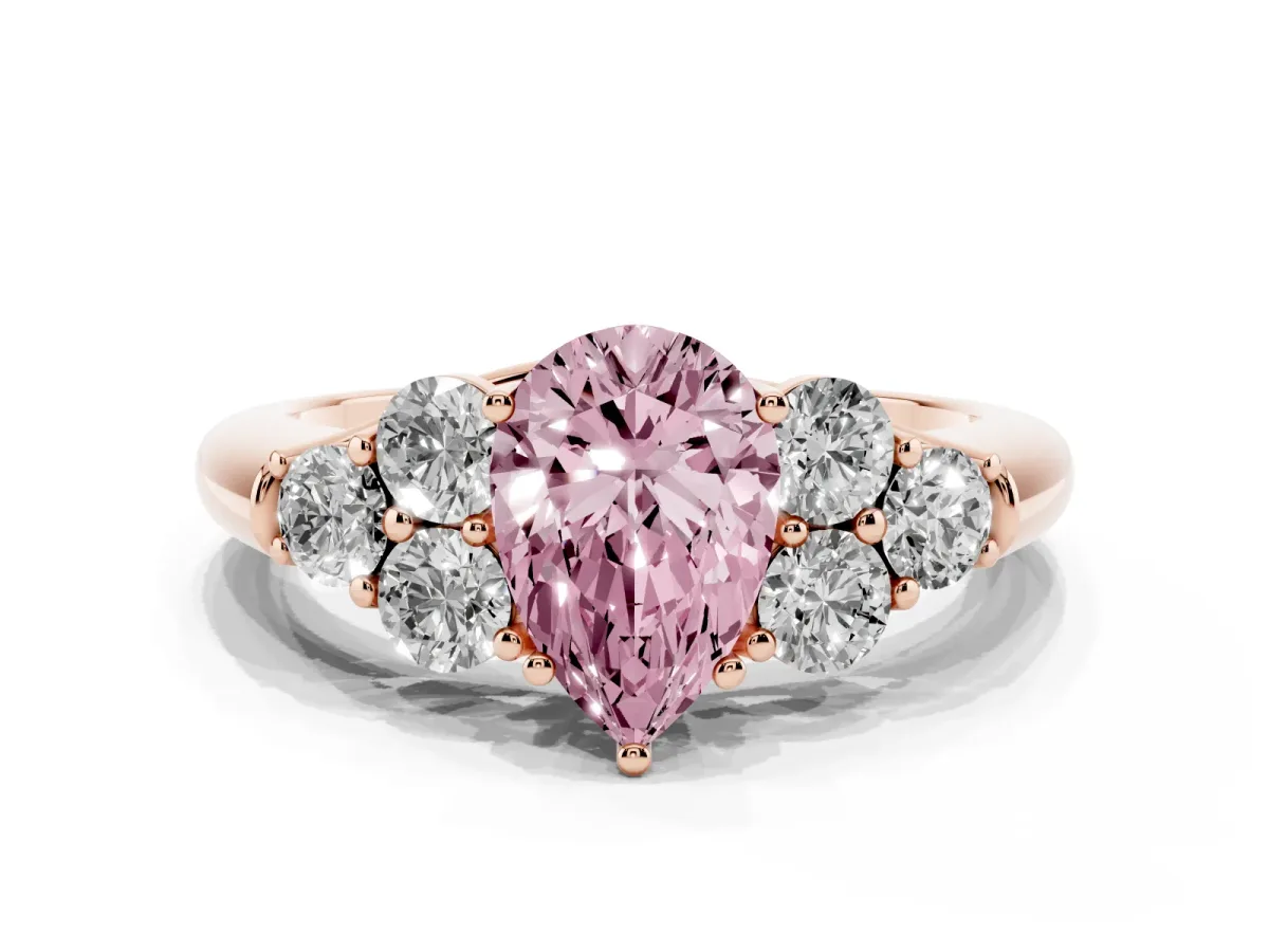 Fancy Pink Pear Cut Cut Diamond Cluster Ring with Round Accent Stones and Prong Setting on a Classic Band Rose gold