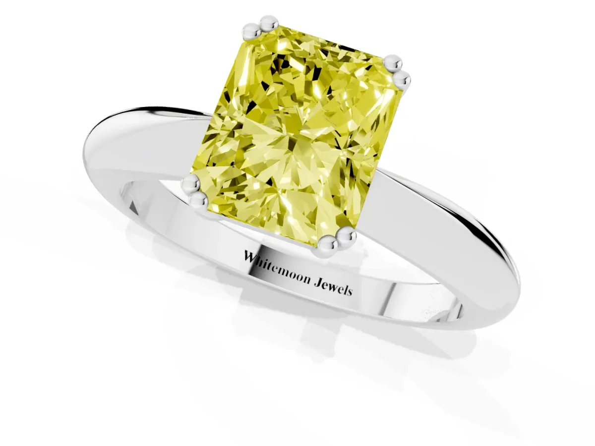Fancy Yellow Radiant Cut Cut Solitaire Engagement Ring with Tapered Band and Four-Prong Setting White gold
