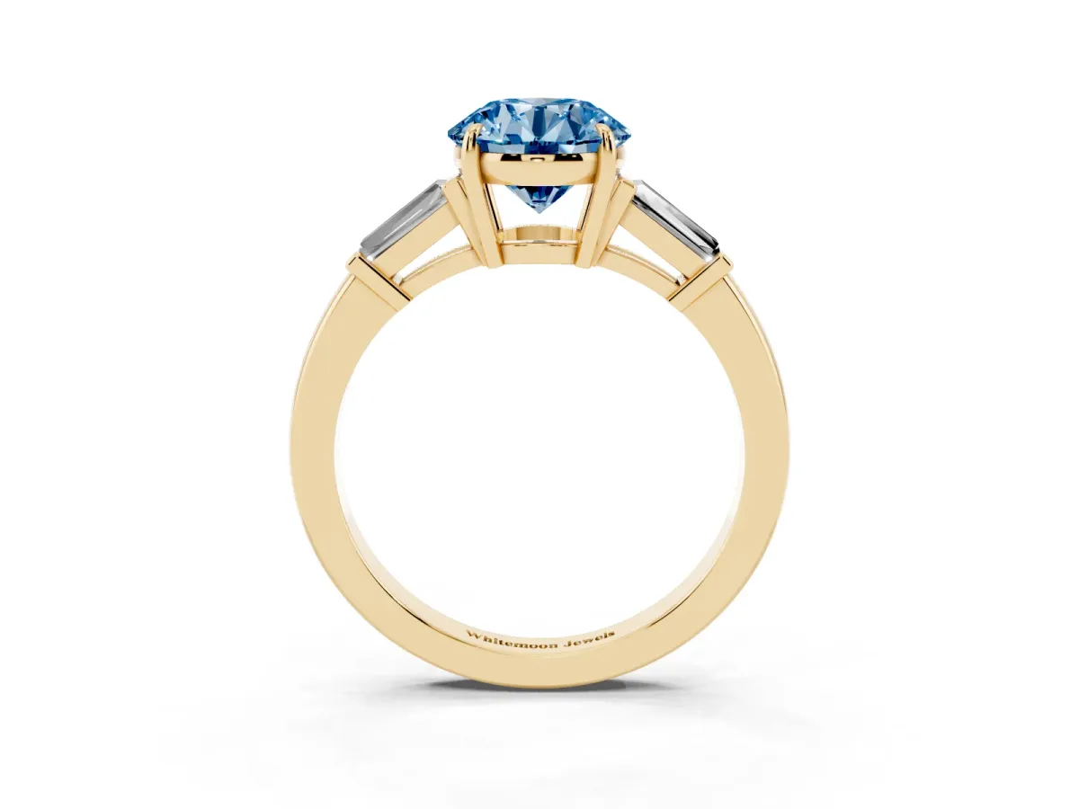 Fancy Blue Round Cut Diamond Three-Stone Ring with Tapered Baguette Side Stones and Prong Setting Yellow gold