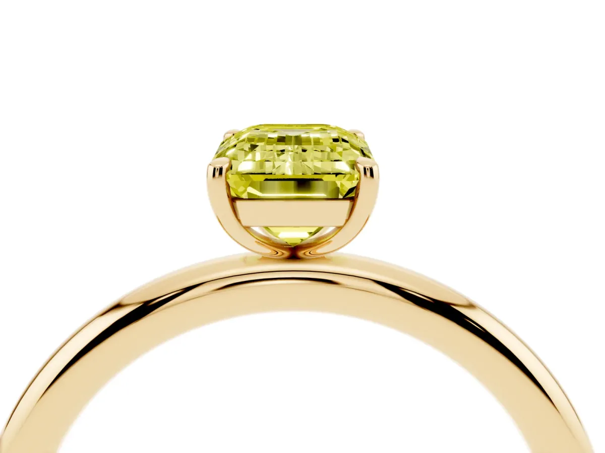 Fancy Yellow Emerald Cut Solitaire Diamond Ring with Four-Prong Setting on a Plain Band Yellow gold