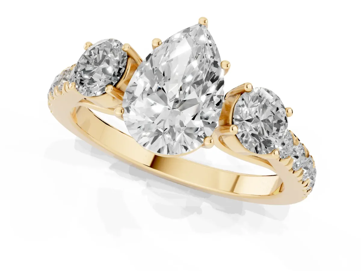 Pear Cut Cut Diamond Three-Stone Ring with Round Side Stones and Pavé Band Yellow gold