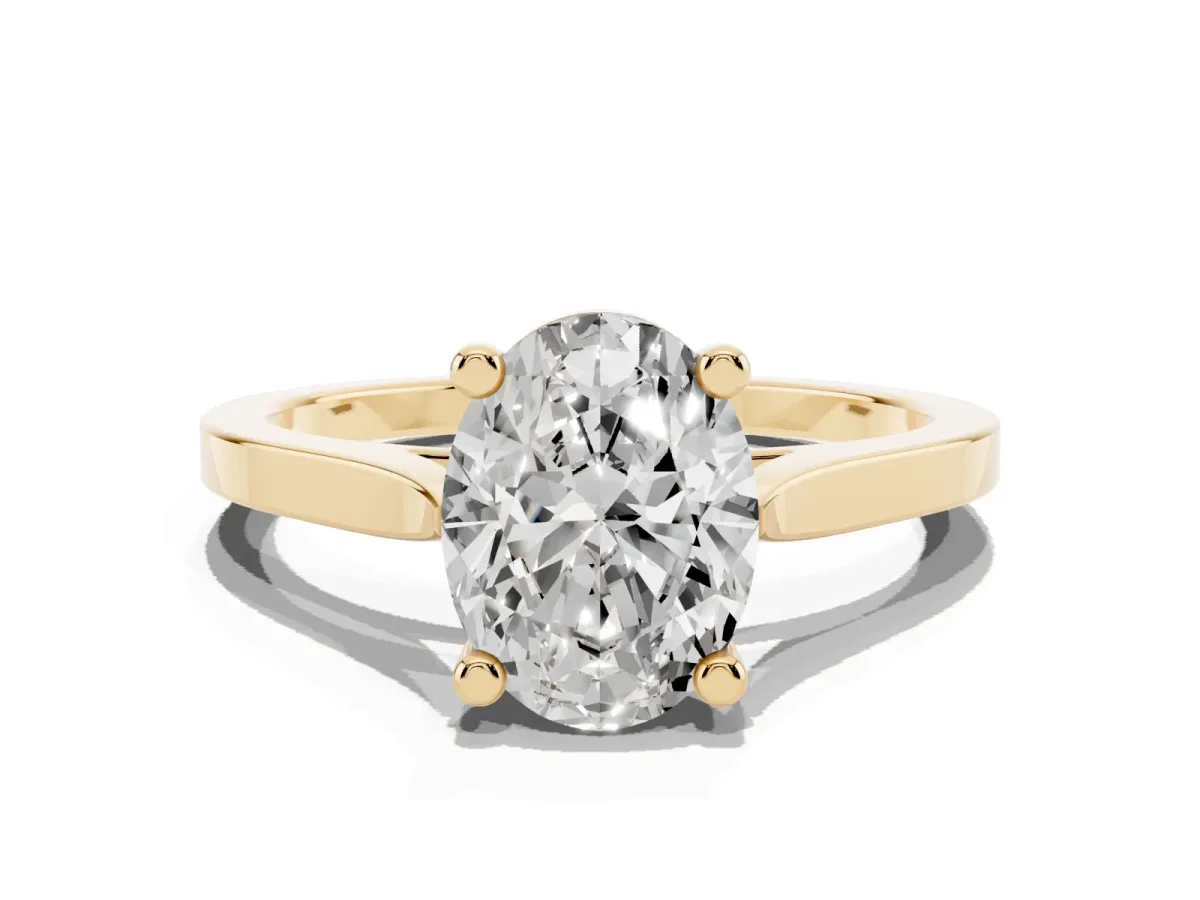 Oval Cut Solitaire Diamond Ring with Four-Prong Setting and Tapered Band Yellow gold