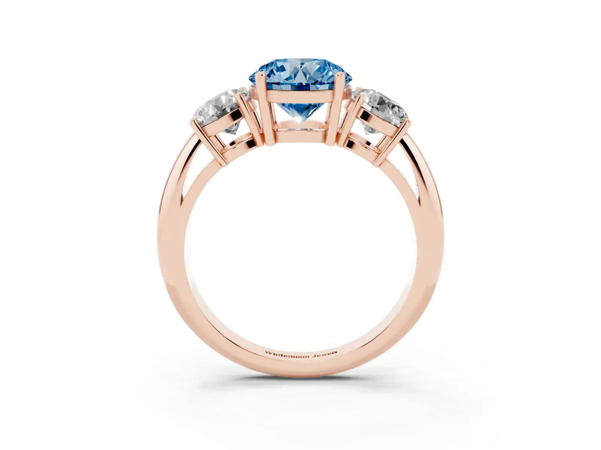Fancy Blue Three-Stone Round Cut Cut Diamond Engagement Ring with Prong Setting on a White Gold Band Rose gold
