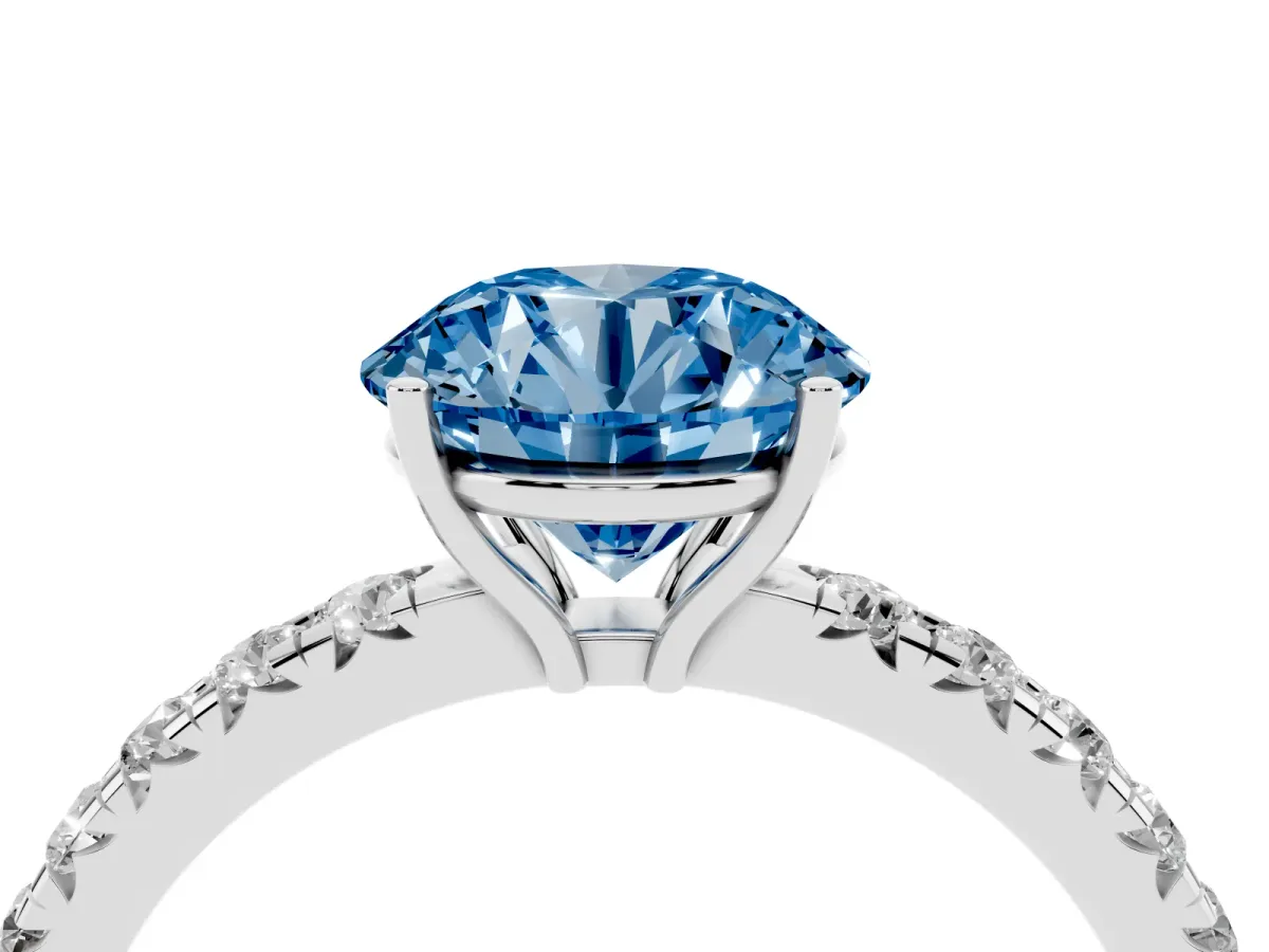 Fancy Blue Round Cut Diamond Pavé Solitaire Engagement Ring with Four-Prong Setting Silver