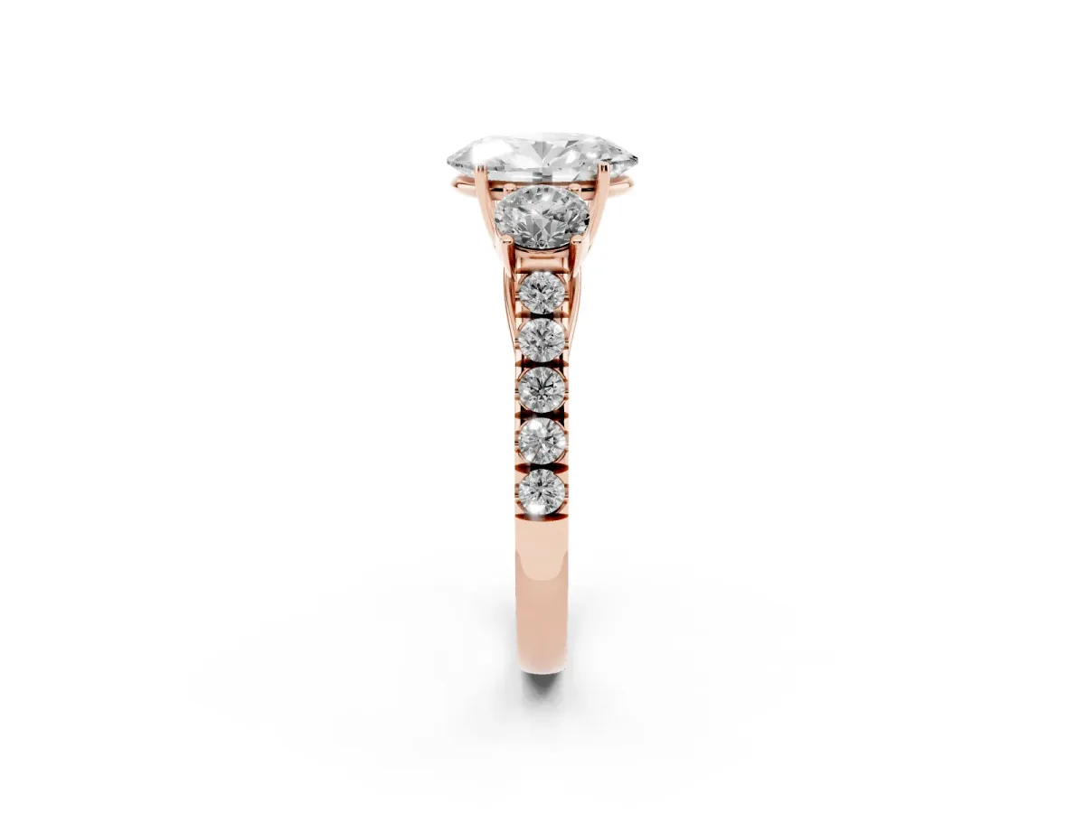 Oval Cut Cut Diamond Three-Stone Ring with Round Side Stones and Pavé Band Rose gold
