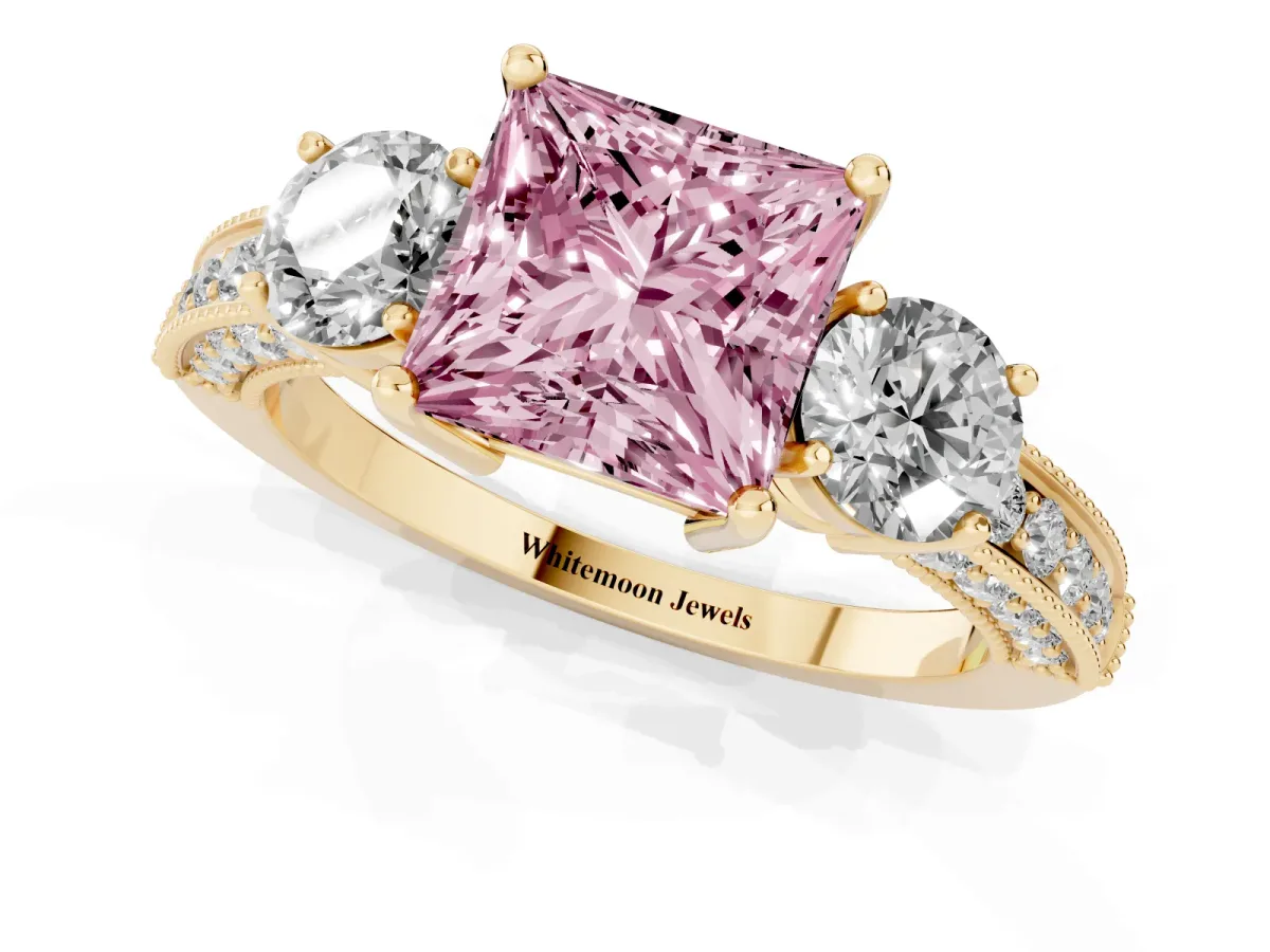 Fancy Pink Princess Cut Three-Stone Diamond Ring with Pavé Band and Four-Prong Setting Yellow gold
