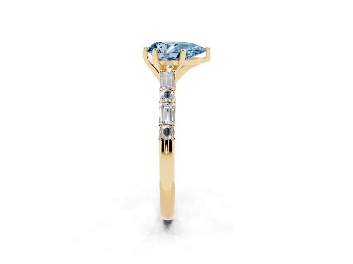 Fancy Blue Pear Cut Diamond Solitaire with Side Baguettes and Channel Set Band Yellow gold
