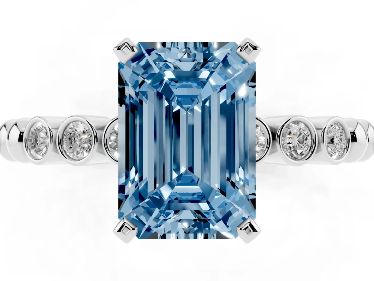 Fancy Blue Emerald Cut Solitaire Bezel Accent Diamond Engagement Ring with Beaded Band and Four-Prong Setting White gold