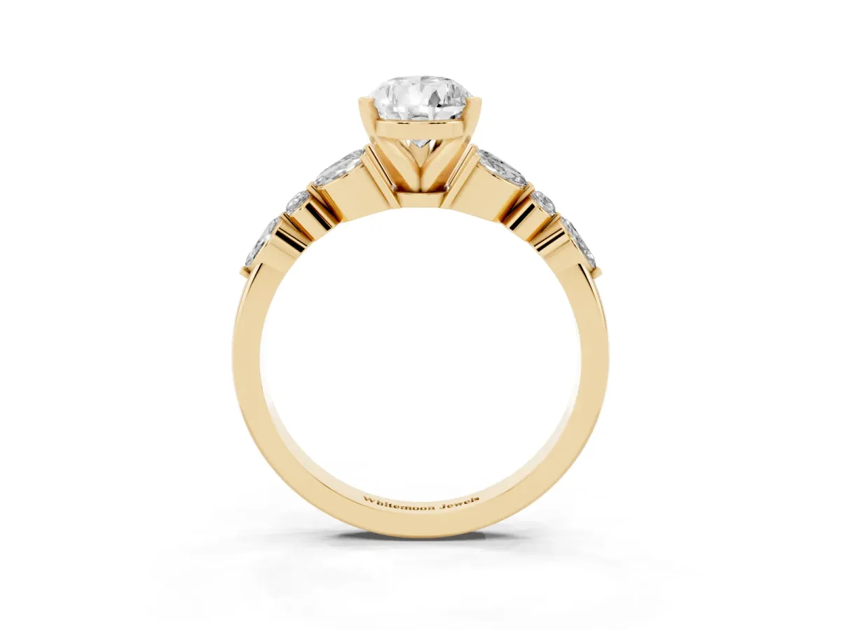 Pear Cut Diamond Solitaire Ring with Side Stones and Four-Prong Setting Yellow gold