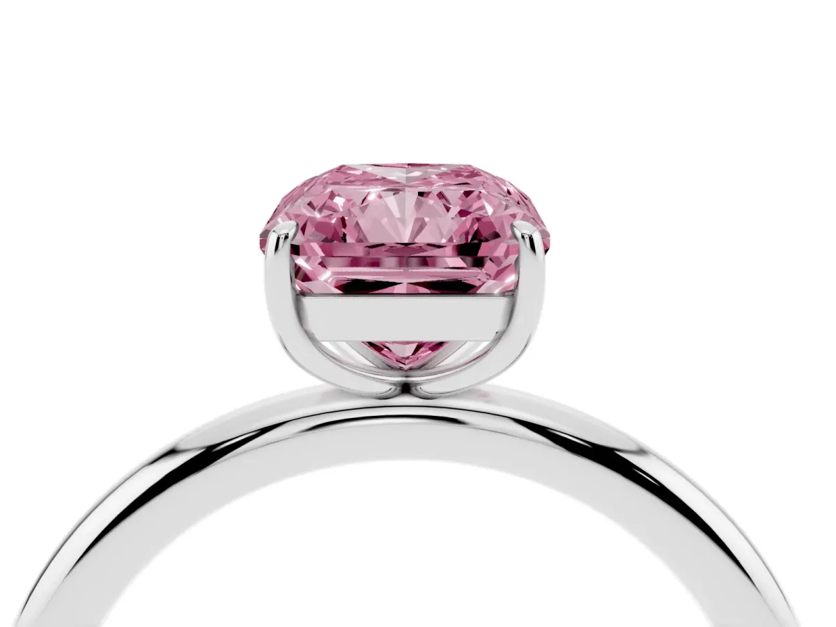 Fancy Pink Radiant Cut Solitaire Diamond Ring with Four-Prong Setting on a Plain Band Platinum