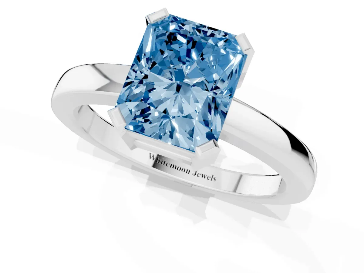 Fancy Blue Radiant Cut Cut Solitaire Ring with Four-Prong Setting and Classic Band Silver