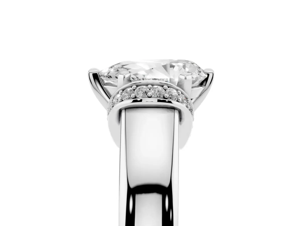 Pear Cut Solitaire Diamond Ring with Pave Band and Six-Prong Setting Silver
