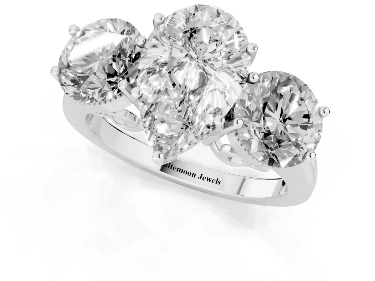 Three-Stone Pear Cut Diamond Engagement Ring with Prong Setting on a Classic Band Silver