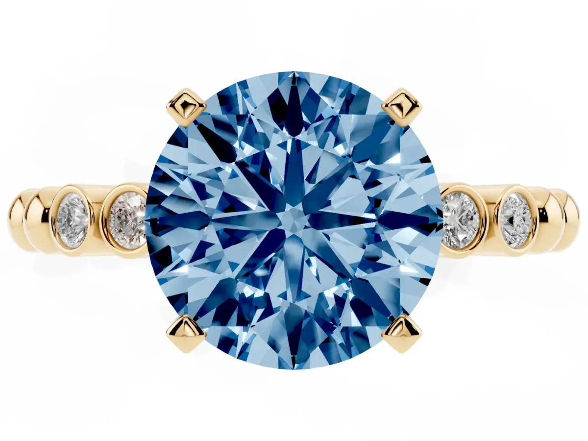 Fancy Blue Round Cut Solitaire Bezel Accent Diamond Engagement Ring with Beaded Band and Four-Prong Setting Yellow gold
