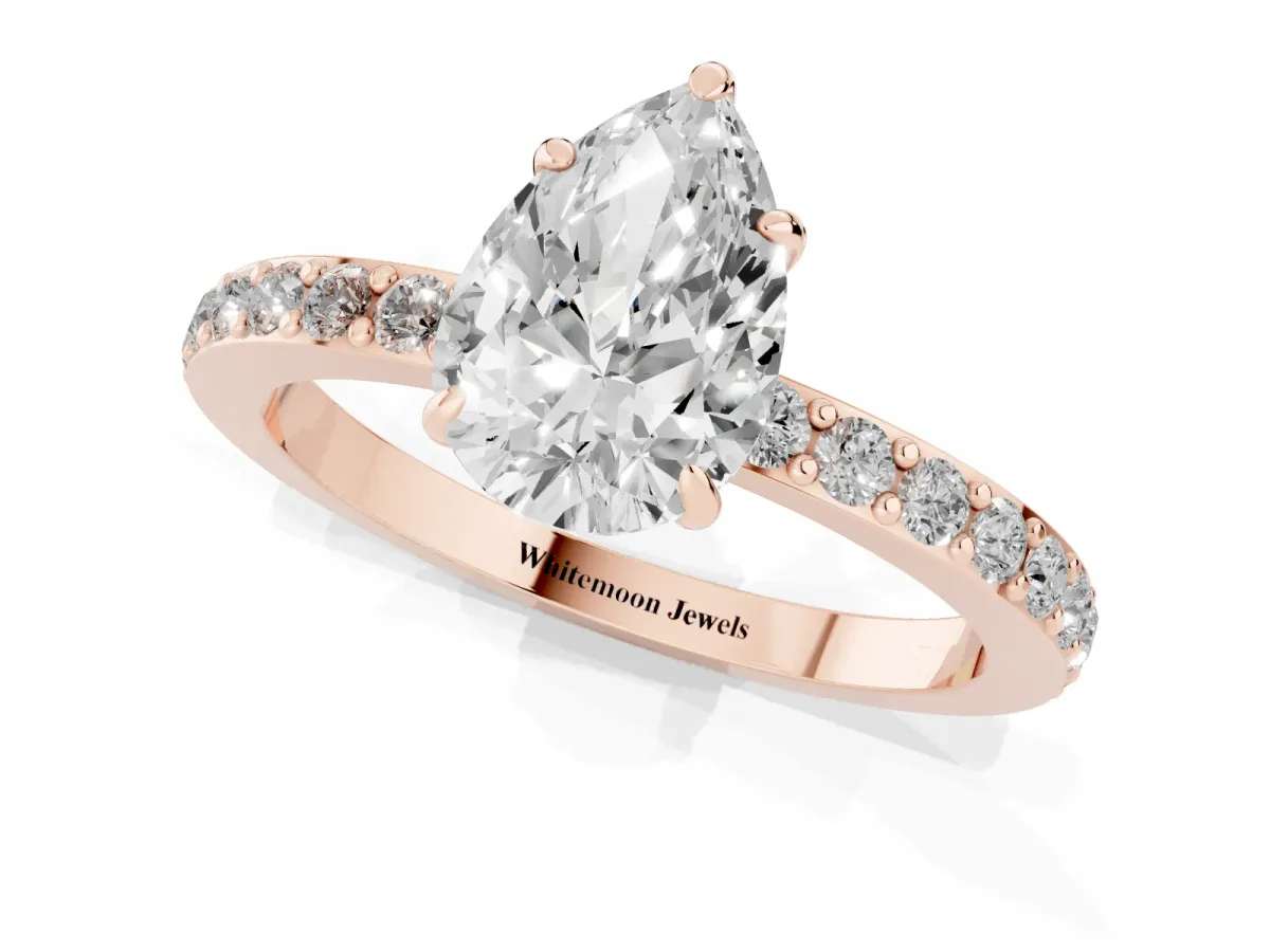 Pear Cut Diamond Pavé Engagement Ring with Round Accents and Prong Setting Rose gold