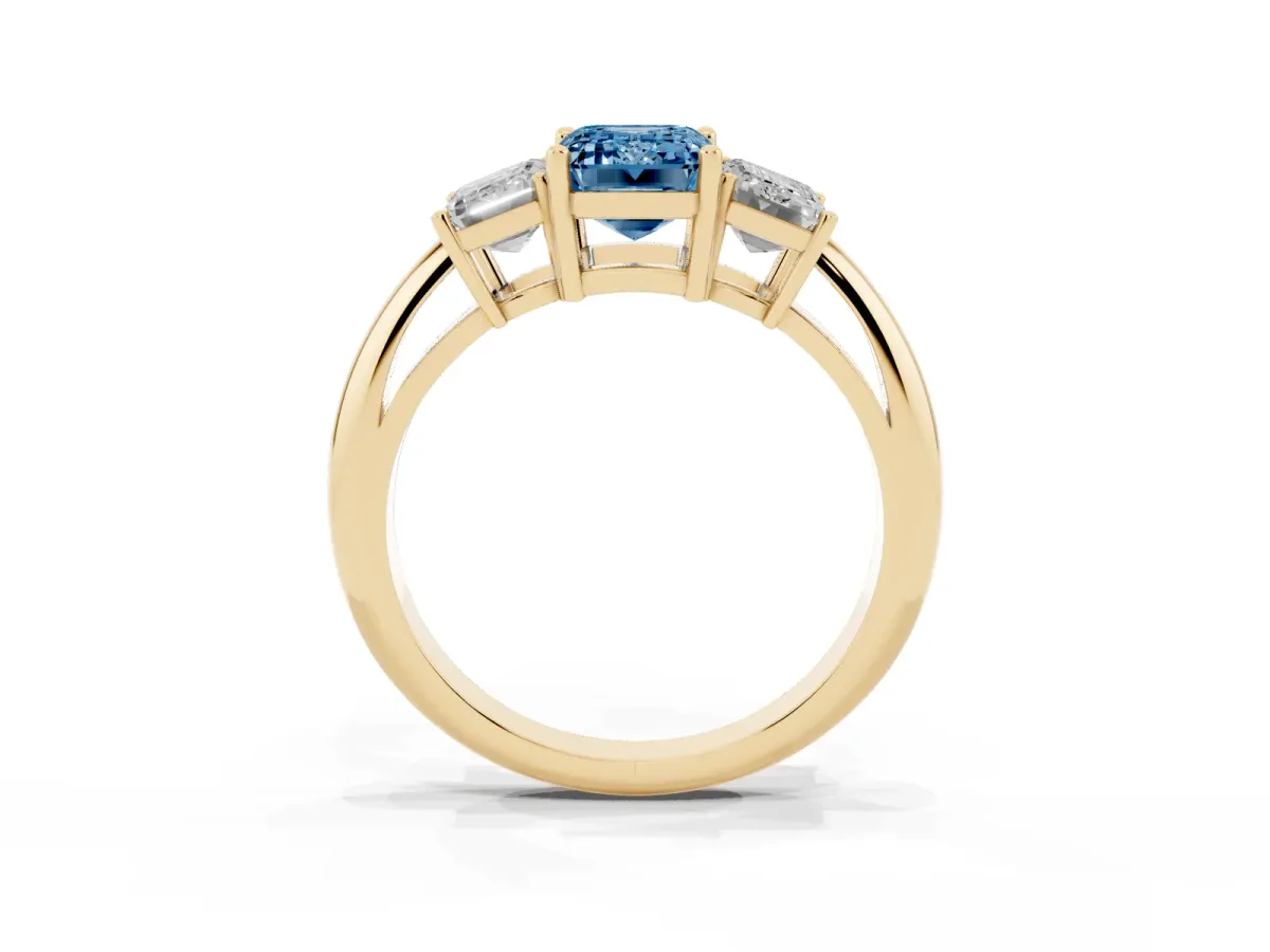 Fancy Blue Three-Stone Emerald Cut Cut Diamond Engagement Ring with Prong Setting on a White Gold Band Yellow gold