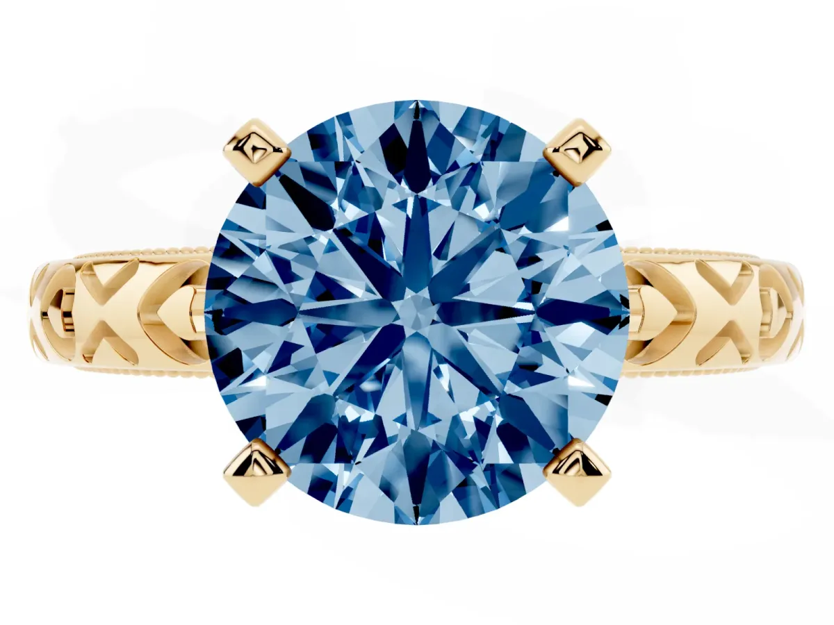 Fancy Blue Round Cut Solitaire Diamond Engagement Ring with XO Engraved Band and Four-Prong Setting Yellow gold
