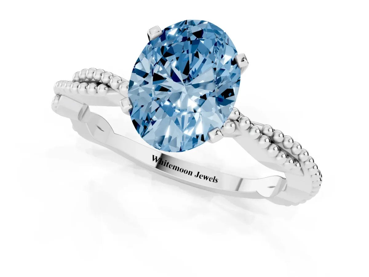 Fancy Blue Oval Cut Solitaire Twisted Band with Bead Prong Setting White gold