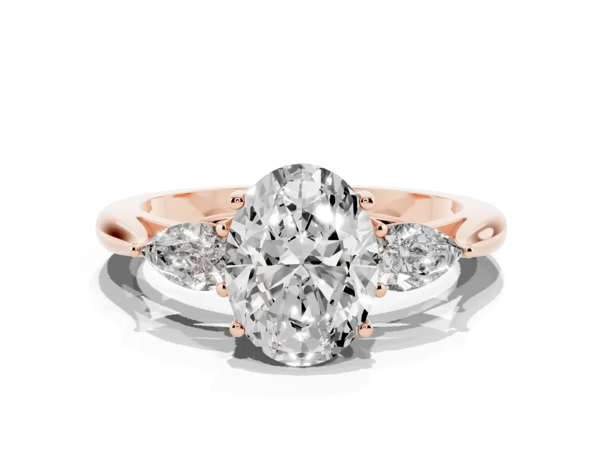 Oval Cut Diamond Three-Stone Ring with Pear Side Stones and Prong Setting Rose gold