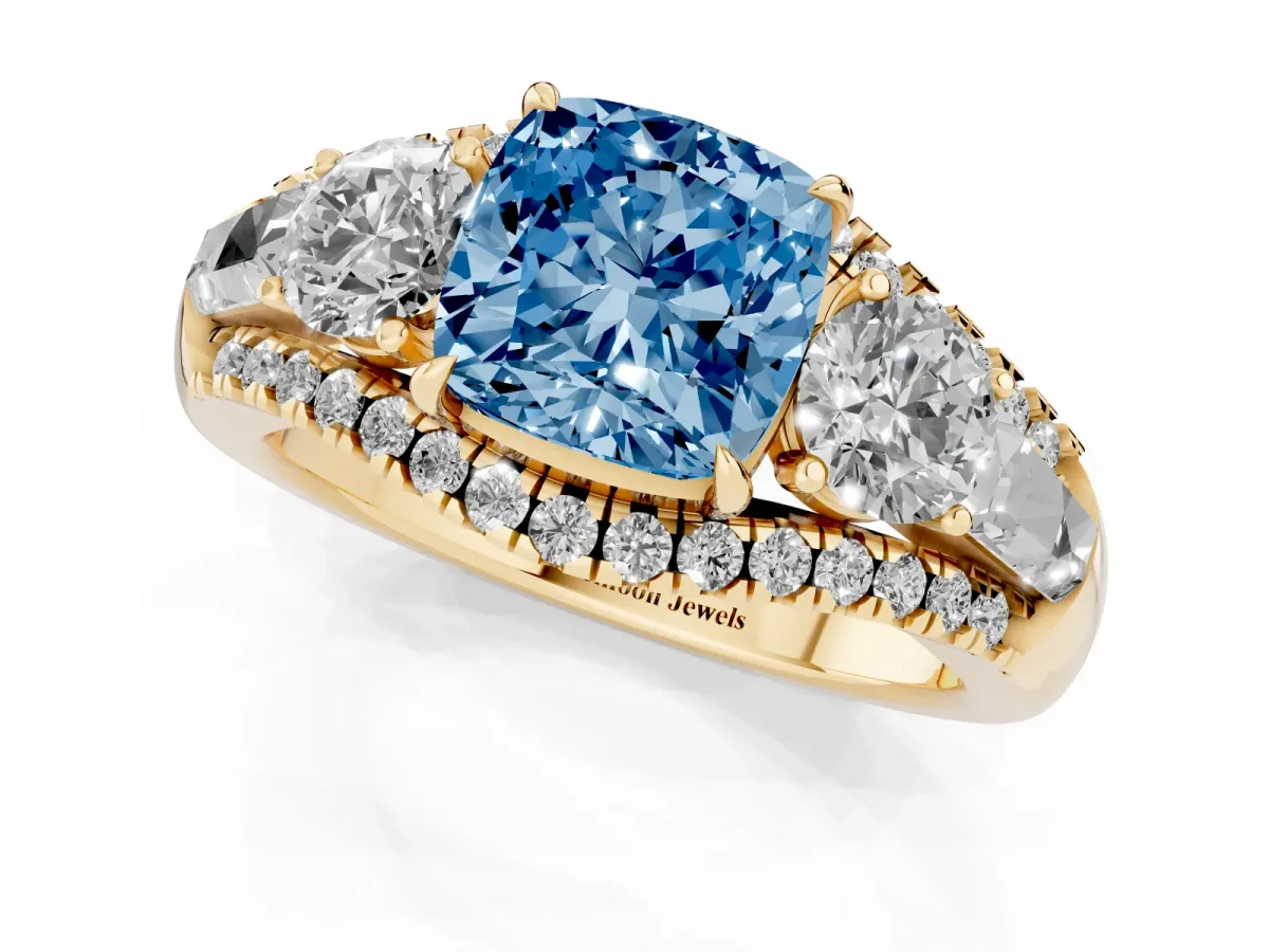 Fancy Blue Three-Stone Cushion Cut Diamond Engagement Ring with Pave Band and Prong Setting Yellow gold