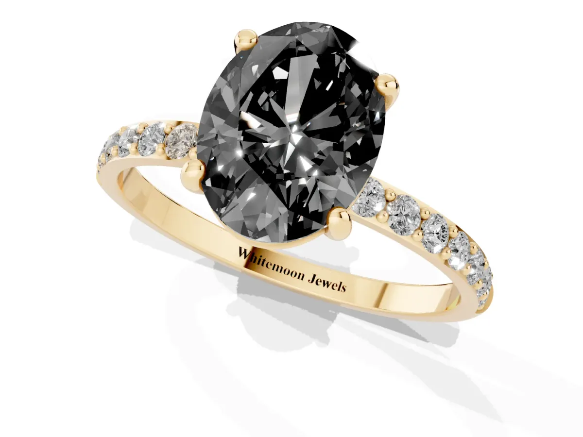 Fancy Black Oval Cut Diamond Solitaire Ring with Round Pavé Band and Prong Setting Yellow gold