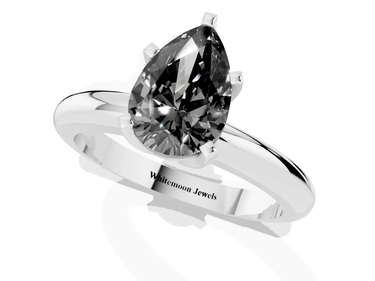 Fancy Black Pear Cut Diamond Solitaire Engagement Ring with Round Band and Four-Prong Setting Platinum