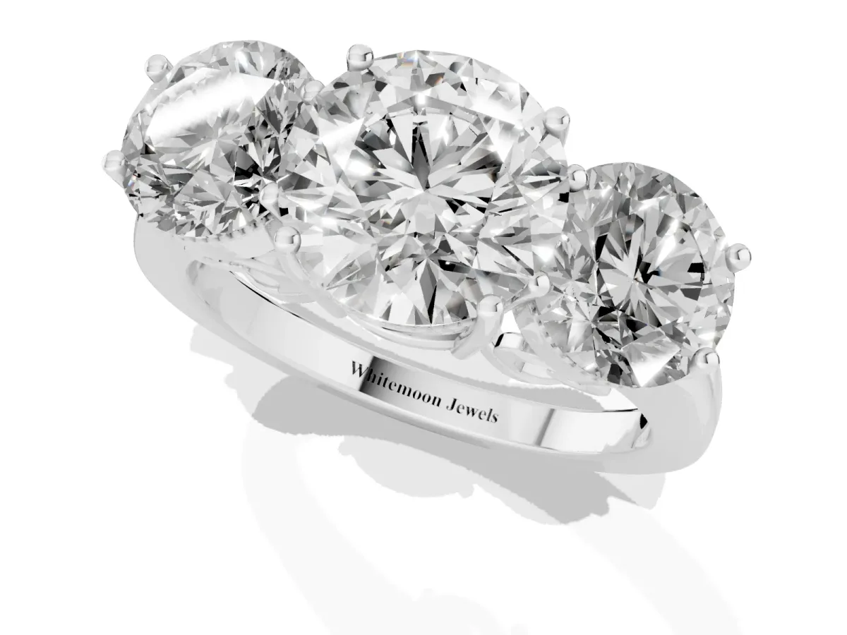 Three-Stone Round Cut Diamond Engagement Ring with Prong Setting on a Classic Band Silver