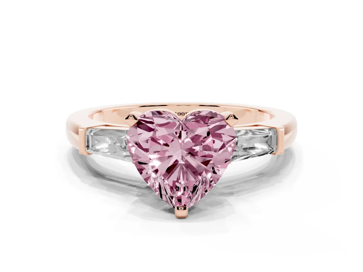 Fancy Pink Heart Cut Solitaire with Tapered Baguette Side Stones on a Classic Band with Four-Prong Setting Rose gold