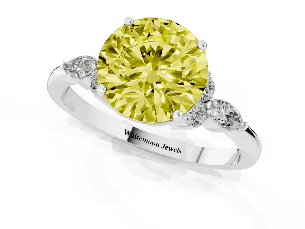 Fancy Yellow Round Cut Brilliant Diamond Solitaire Ring with Pear Side Stones and Four-Prong Setting White gold