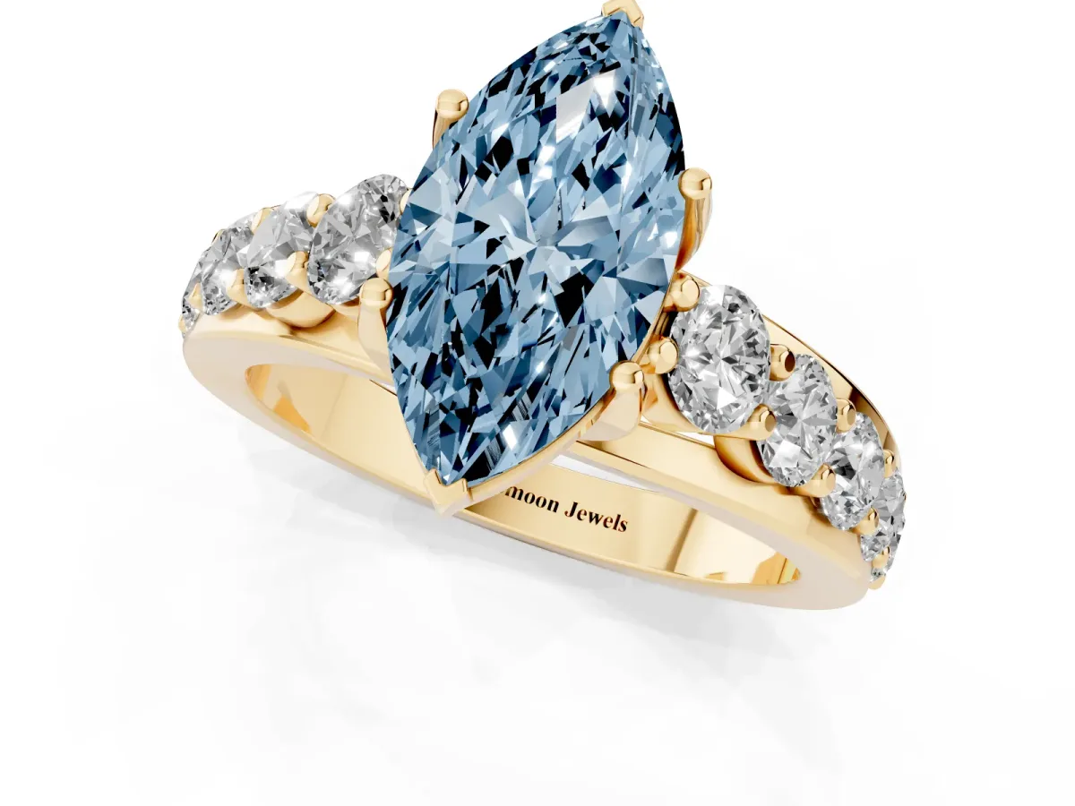 Fancy Blue Marquise Cut Diamond Engagement Ring with Pavé Band and Four-Prong Setting Yellow gold