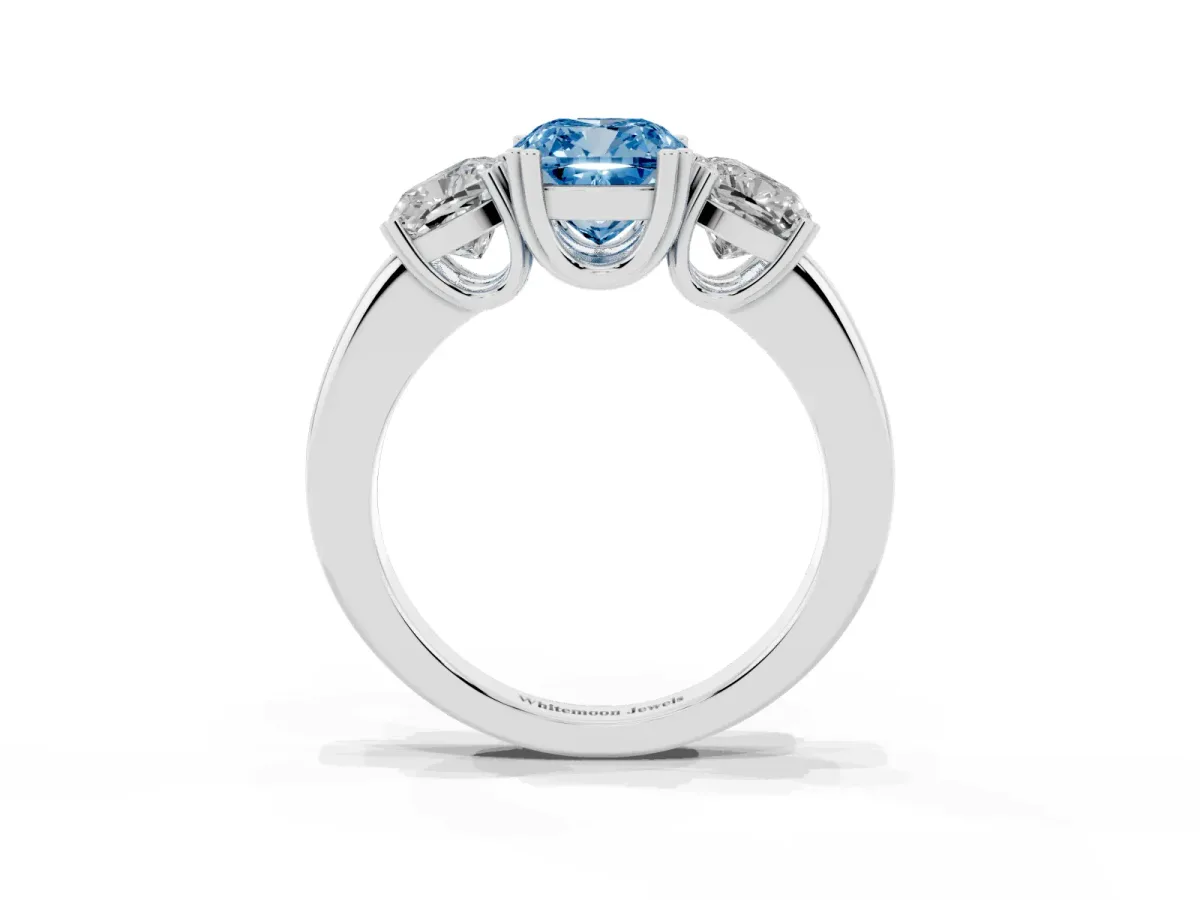 Fancy Blue Three-Stone Cushion Cut Cut Diamond Ring with Channel Set Band and Four-Prong Setting Platinum