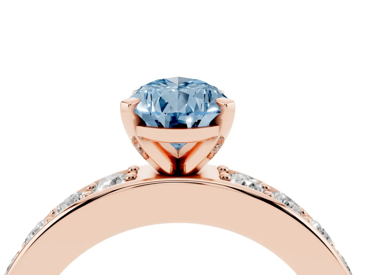 Fancy Blue Pear Cut Diamond Engagement Ring with Channel Set Round Band and Prong Setting Rose gold