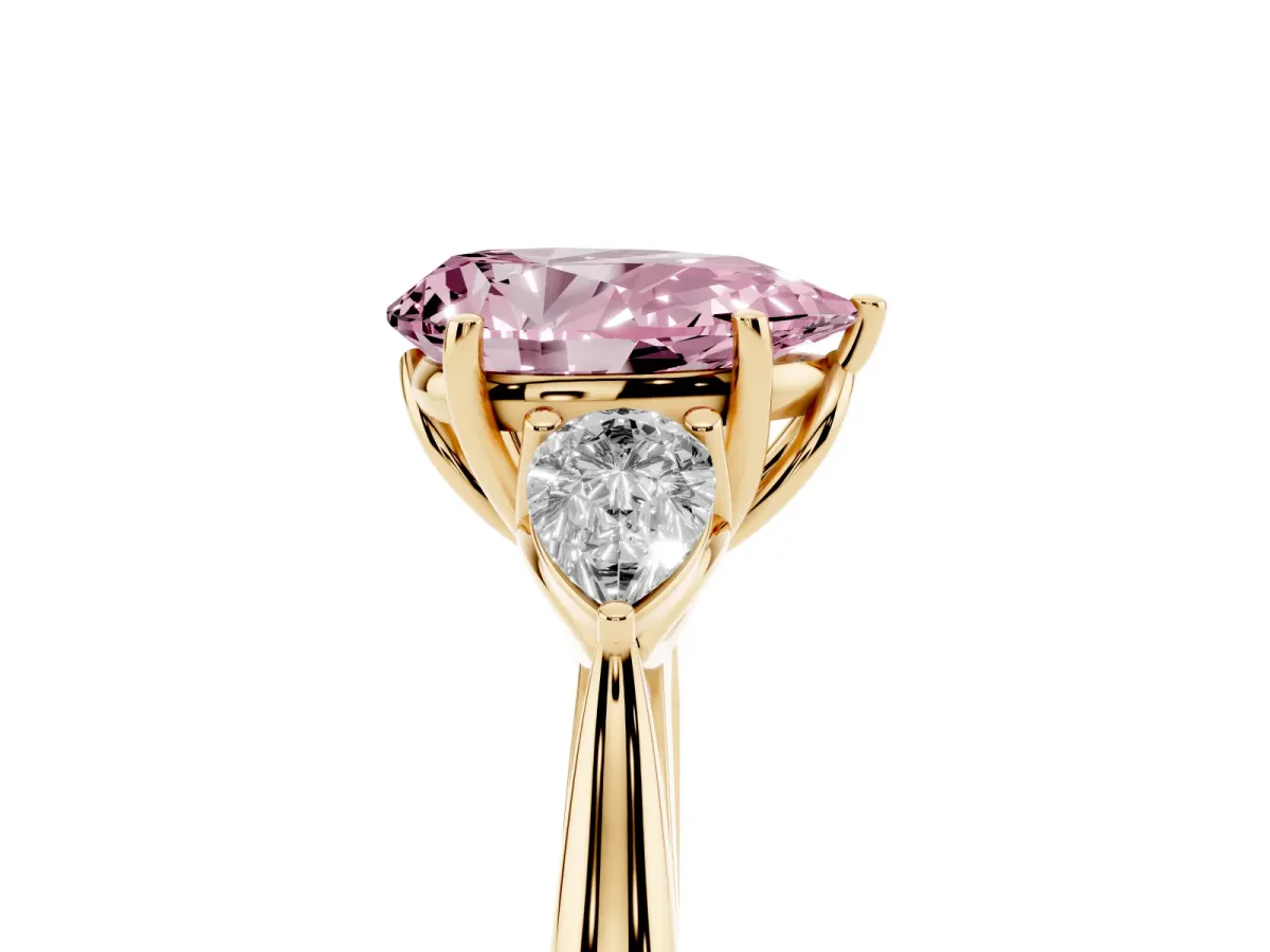 Fancy Pink Pear Cut Diamond Three-Stone Ring with Pear Side Stones and Prong Setting Yellow gold
