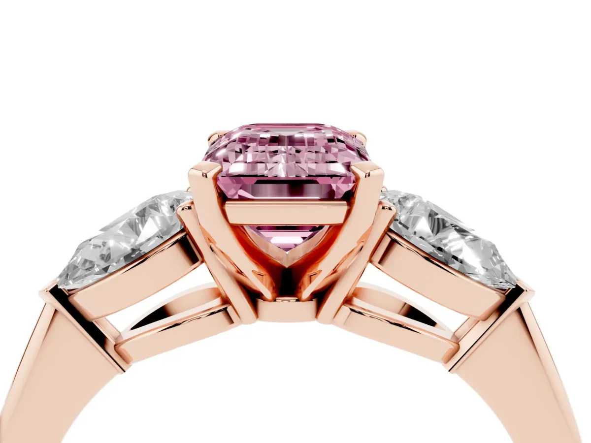Fancy Pink Three-Stone Emerald Cut Diamond Ring with Pear Side Stones and Four-Prong Setting Rose gold